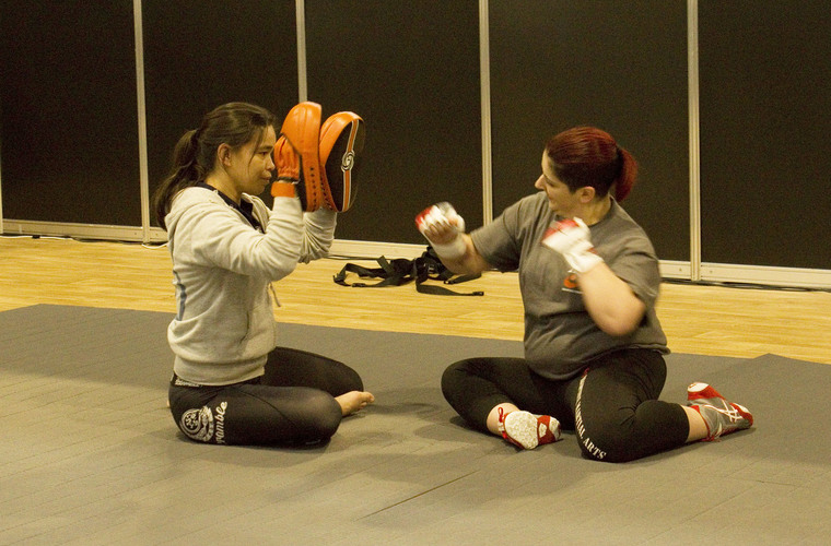 Two students taking part in an Adaptive Martial Arts Class