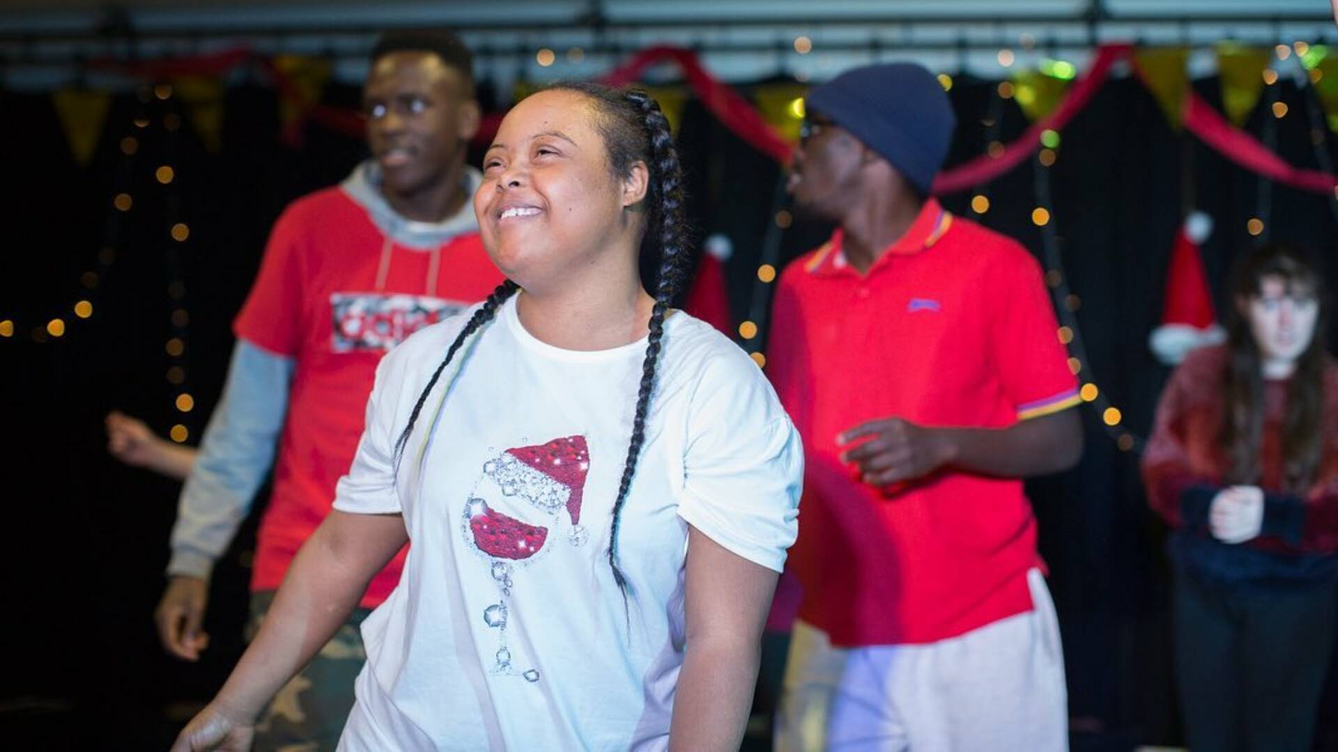 Group of disabled and non-disabled young people taking part in an inclusive performance. 