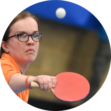 Young woman with dwarfism playing table tennis