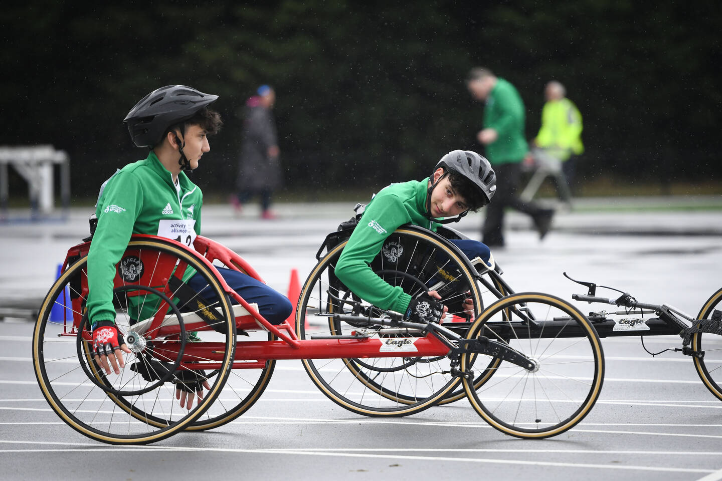 Two young wheelchair racers on track at the National Junior Athletics Championships 2024.