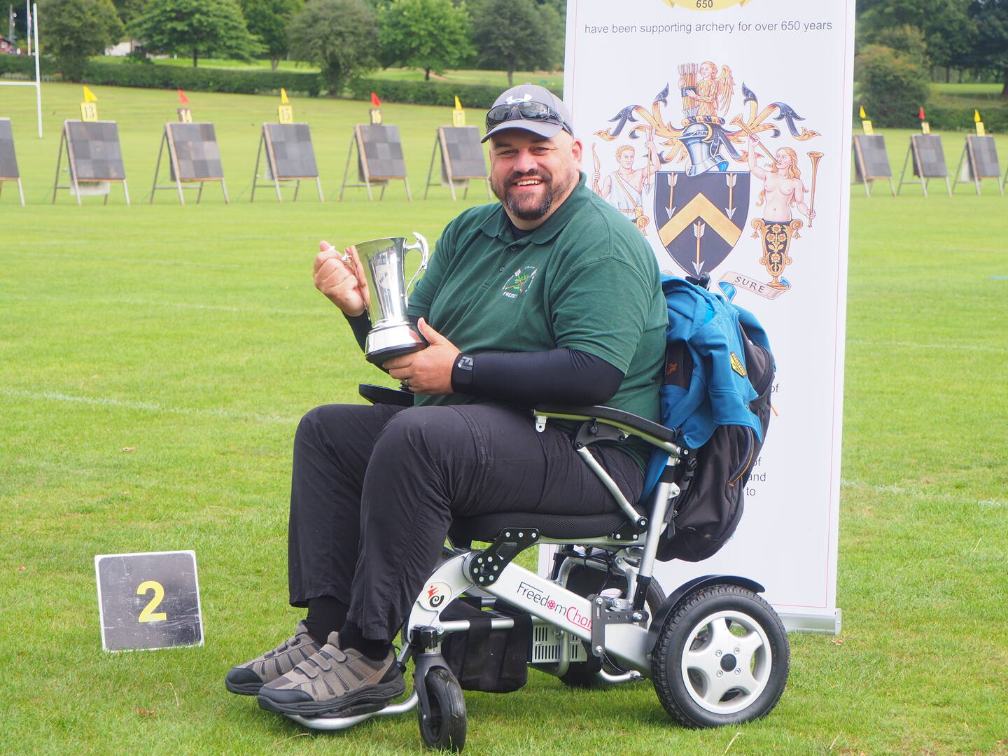 A wheelchair user holds a trophy at the Disability Championships at Lilleshall National Sports Centre.