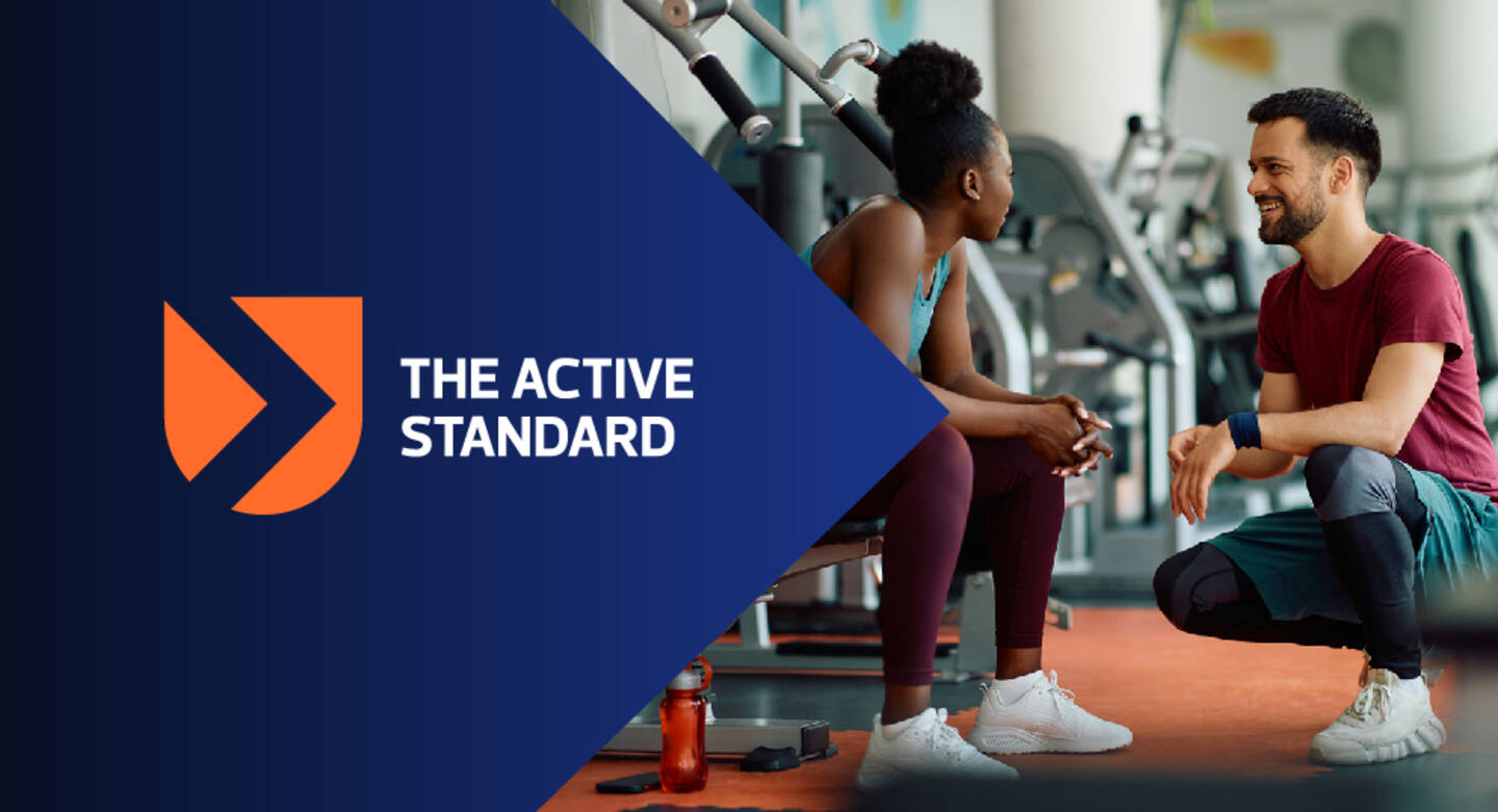 Image shows two people in a leisure gym environment and The Active Standard branding.